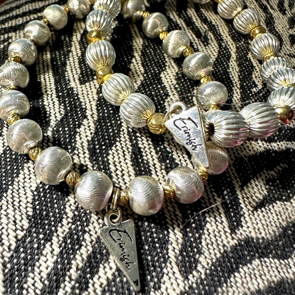 Pair of Ermish Silver and Gold Beaded bracelets with charms.